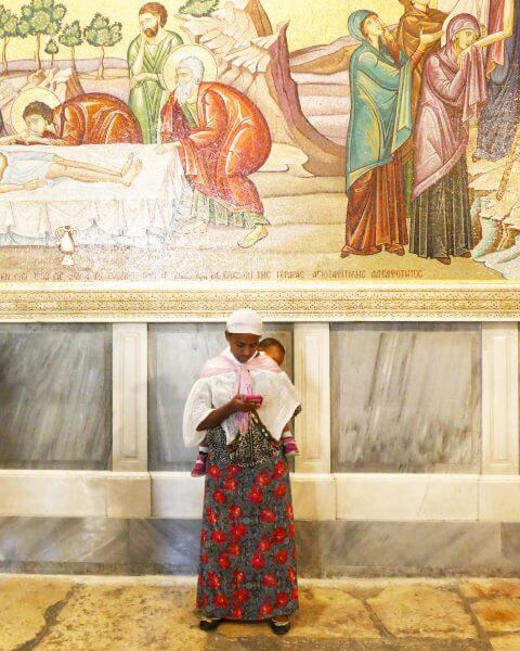 Beautiful Woman inside the Church of the Holy Sepulchre in Jerusalem