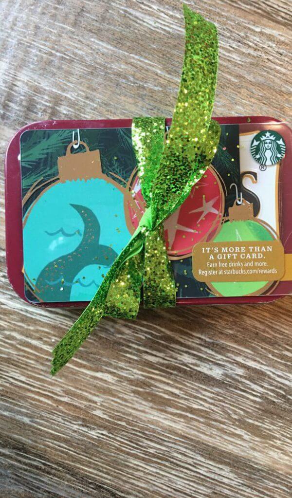 holiday gift of gift card plus recycled gift card guitar picks in a tin